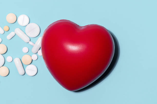 istock red heart and pills on a blue background 1281155815