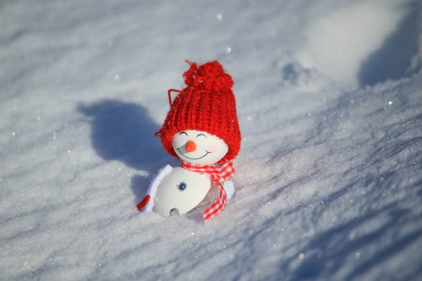 istock snowman lay in the snow 1281157630