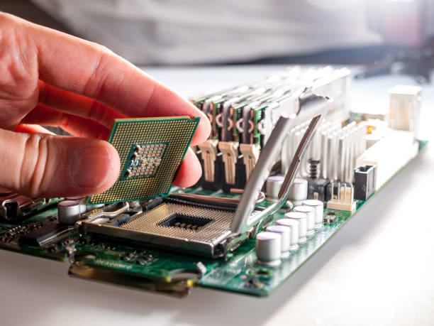 istock CPU connector on the circuit motherboard with pressure contacts for connecting a silicon microprocessor, CPU selection during computer assembly 1281160745