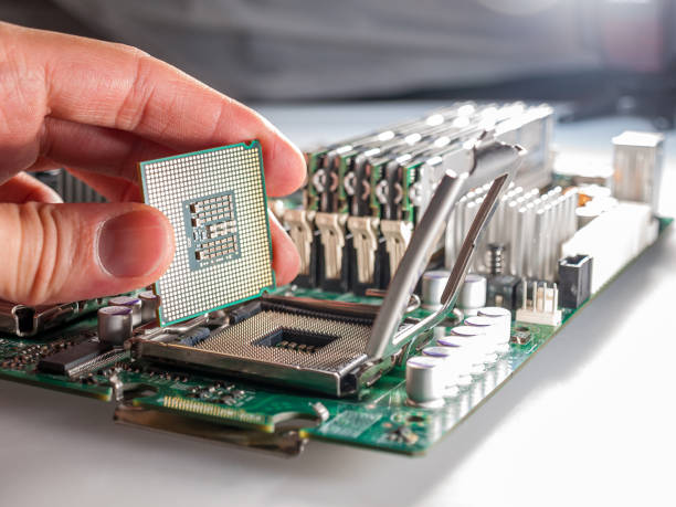 istock CPU connector on the circuit motherboard with pressure contacts for connecting a silicon microprocessor, CPU selection during computer assembly 1281160754
