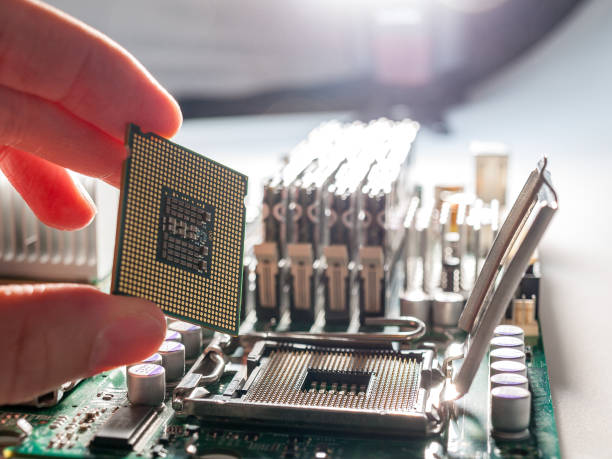 istock CPU connector on the circuit motherboard with pressure contacts for connecting a silicon microprocessor, CPU selection during computer assembly 1281160757