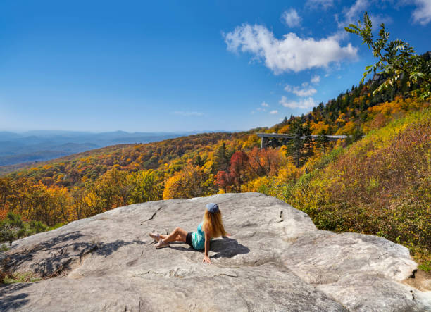 istock Girl enjoying beautiful fall mountain scenery. 1281162584