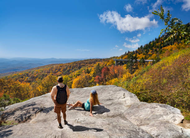 istock Couple looking at beautiful autumn scenery in the mountains. 1281163361