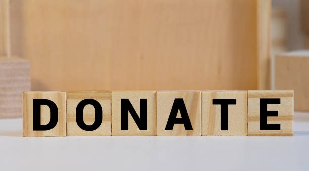 istock donate word background on wood blocks 1281169082