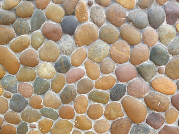 istock Wall round stone rock texture and seamless background 1281169969