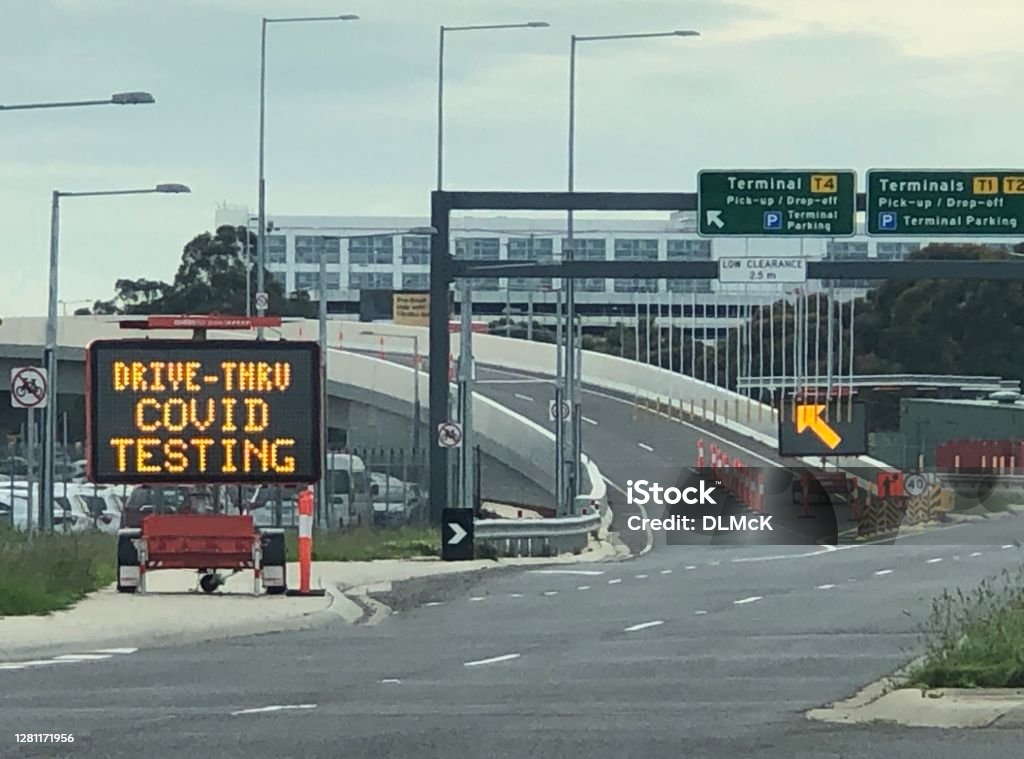 Drive through Covid testing A sign showing the set up of drive through Covid testing at an airport location Coronavirus Stock Photo