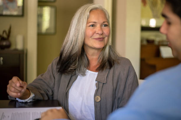 istock A senior woman meets with a financial advisor 1281172858