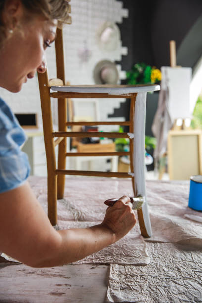 istock Using isolation time to bring life to an old wooden chair 1281173015