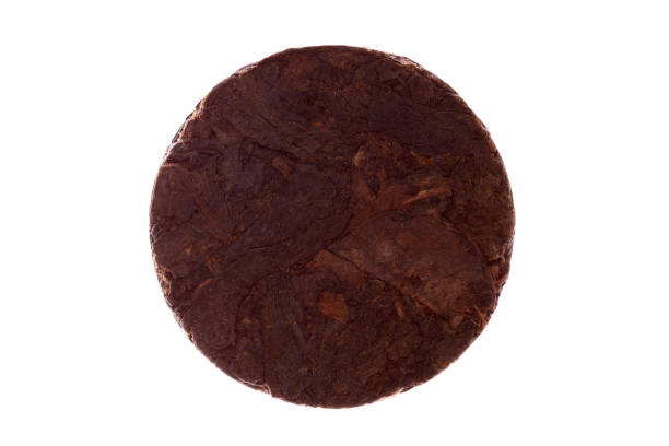 istock round shape black pu-erh tea isolated on white background 1281177239