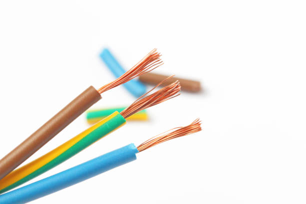 istock Three copper wires with stripped color insulation, pieces of insulation, white background, close-up. 1281178706