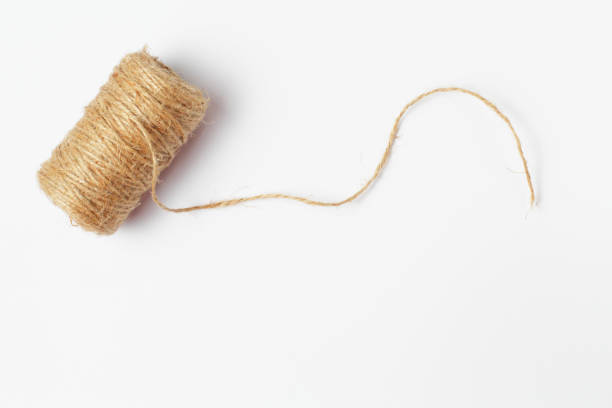 istock Skein of jute coarse threads on a white background close-up, place for text. 1281178743