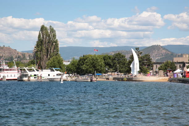 View of Okanagan Lake waterfront with iconic sculpture The Spirit of Sail in Kelowna , BC, Canada stock photo