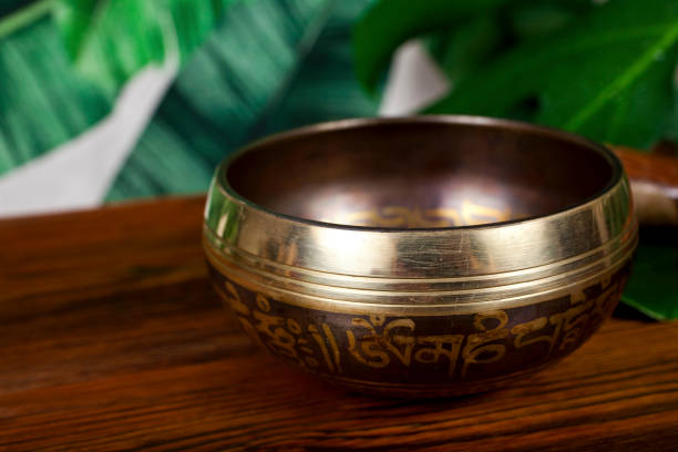 istock Tibetan singing bowl with green leaves 1281181068