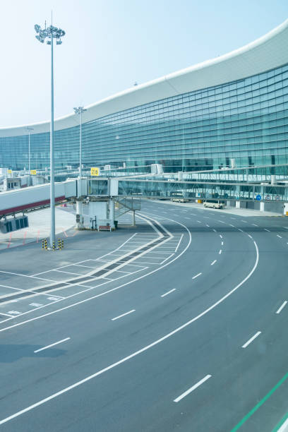 istock Internal road, passenger boarding bridge and airport terminal 1281181933