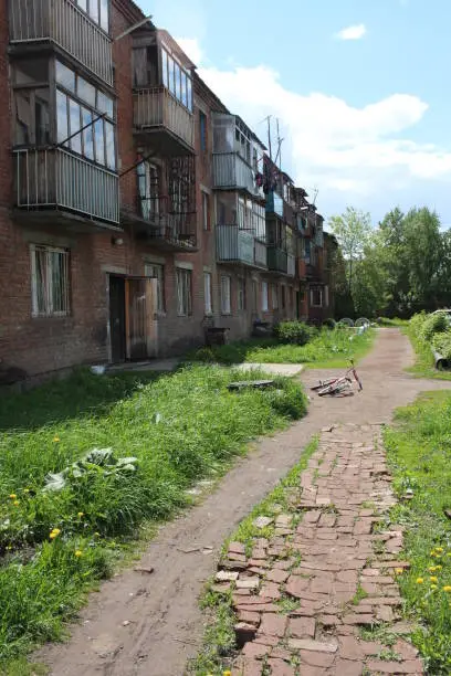 yard near the house in the summer path is a Bicycle abandoned