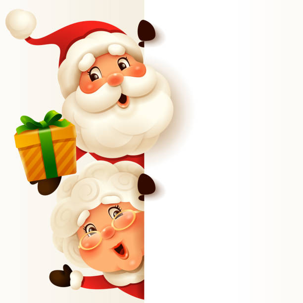 istock Santa Claus and Mrs.Claus with big blank signboard. 1281190663