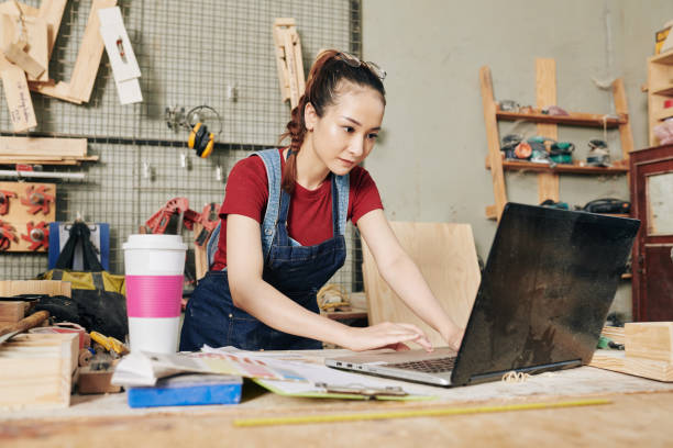 istock Female carpenter ordering wood 1281190732