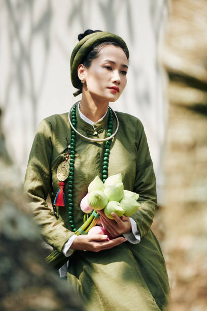 istock Pensive woman with lotus flowers 1281190796