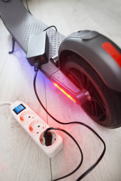 istock Battery charging process of electric motorized scooter. 1281191630