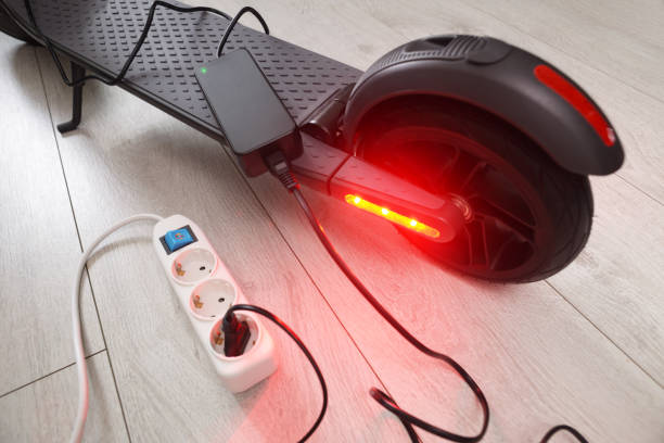 istock Battery charging process of electric motorized scooter. 1281191670