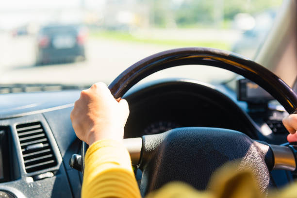 istock woman while driving the car 1281192227