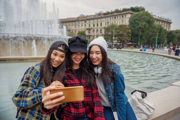 istock Three asian female friends exploring the city 1281192638