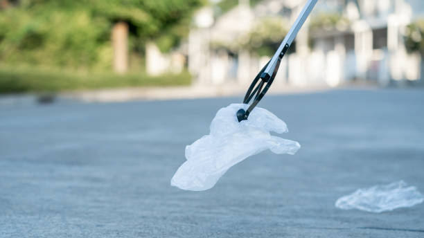 istock Garbage collector equipment keeping plastic waste on the ground. 1281193177