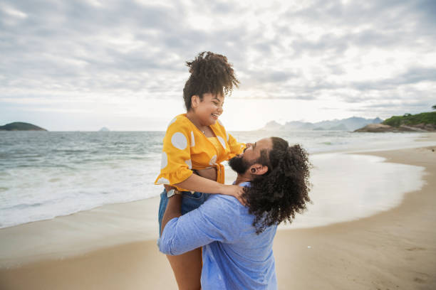 istock Happy couple at the beach 1281193415