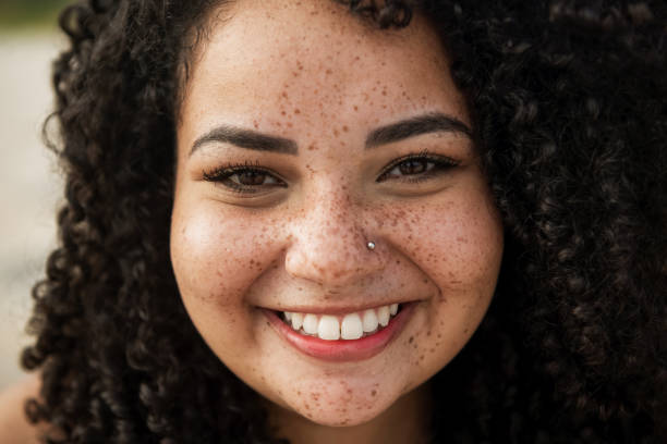 istock Smiled girl with a curly hair 1281193451