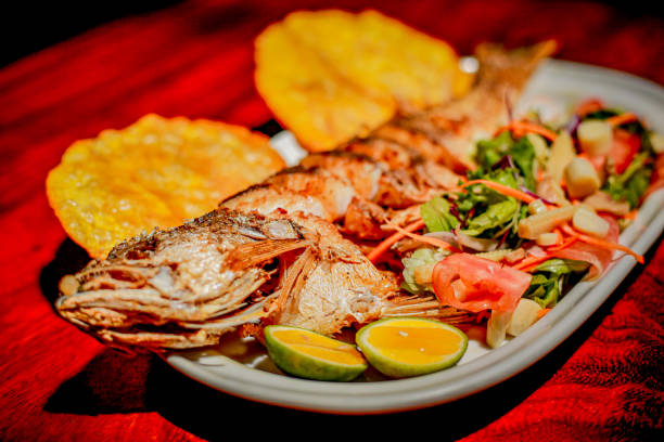 istock Fried fish with patacon and salad 1281193558
