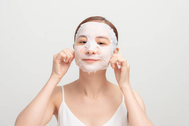istock young woman in cosmetic mask on face 1281193571