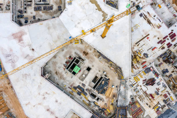 istock monolithic construction of the modern building. crane and construction materials. construction site background. aerial top view 1281193768