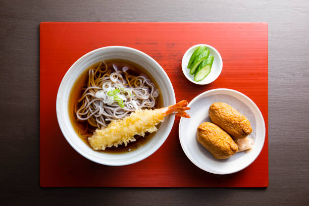 Set meal of tempura soba and Inari sushi stock photo