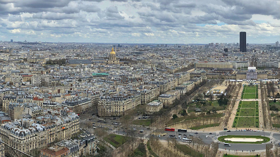 Paris cityscape from the top the Eiffel tower. Looking over the famous Domes Les Invalides a home to Napoleon tomb, museums and monuments