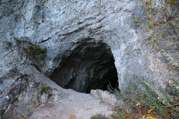 istock old abandoned galleries, adits, for extraction and processing of natural stone and gypsum cave. Dark eerie stone, quartz tunnels deep in  earth. Various rocks, geological and speleological research. 1281204414