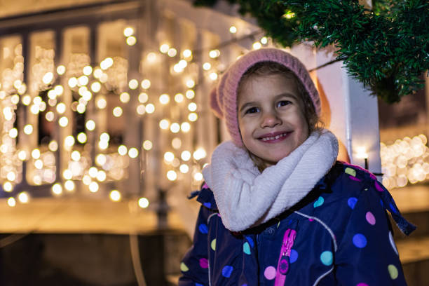 istock Beautiful girl with Christmas lights 1281204709