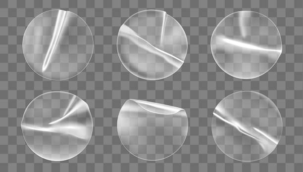 istock Transparent round adhesive stickers mock up set isolated on transparent background. Plastic crumpled round sticky label with glued effect. Template of a label or price tags. 3d realistic vector mockup 1281204862