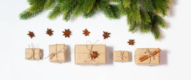 istock Christmas flat lay banner with copy space mockup. Present boxes and fir tree branches composition 1281205707