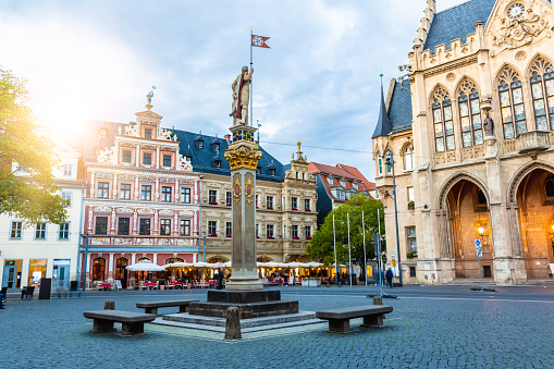 Žatec, Czech Republic, June 11, 2023: View of the main square in this Bohemian town with the fountain and the town hall in the background on a sunny spring day.