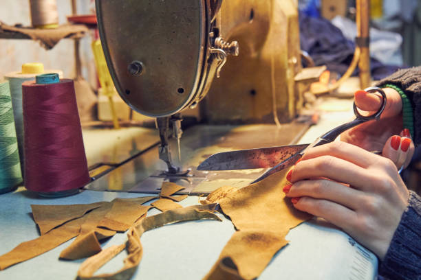 istock Woman tailor using retro sewing machine at home, hobby concept. 1281207009