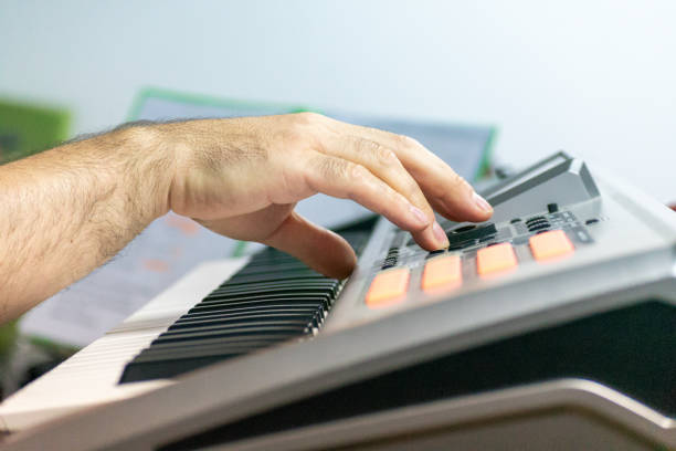istock pianist hand playing electric piano 1281207996
