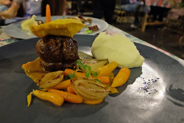 istock Roasted beef tenderloin steak served with mashed potato and side vegetables 1281209864