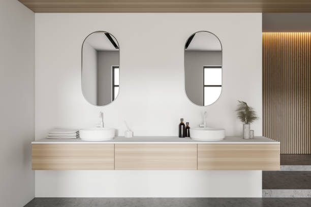istock Double sink in modern white and wooden bathroom 1281210048