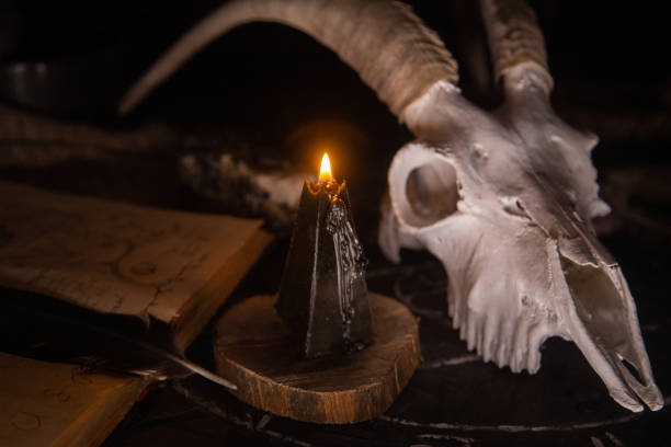 istock White goat scull with horns, open old book, magic spells, runes, black candles 1281210137