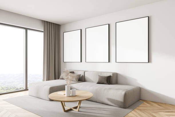 istock White living room corner with sofa and posters 1281210299