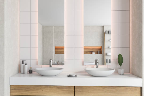istock Double sink and mirrors in white bathroom 1281210409