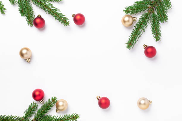 istock Minimal christmas composition. Fir tree branches with red and gold christmas balls on white background. Top view. Copy space 1281211507