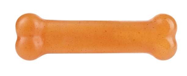 istock Dog bone orange pet toy perfect isolated on white background 1281211742