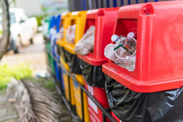 istock Close up image different colored recycle garbage trash Bins in the park. 1281214528