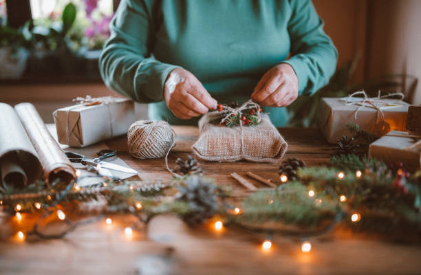 istock Woman wrapping Christmas gifts. 1281215546